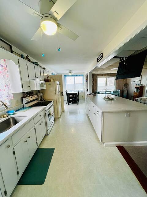 Kitchen area open to the living room, views of the ocean.