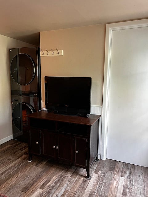 TV in den and washer dryer unit