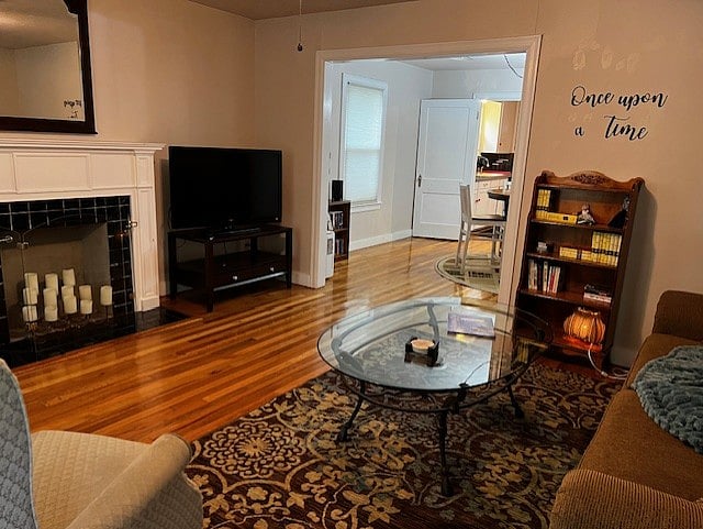 Living room view of TV and going in to dining room