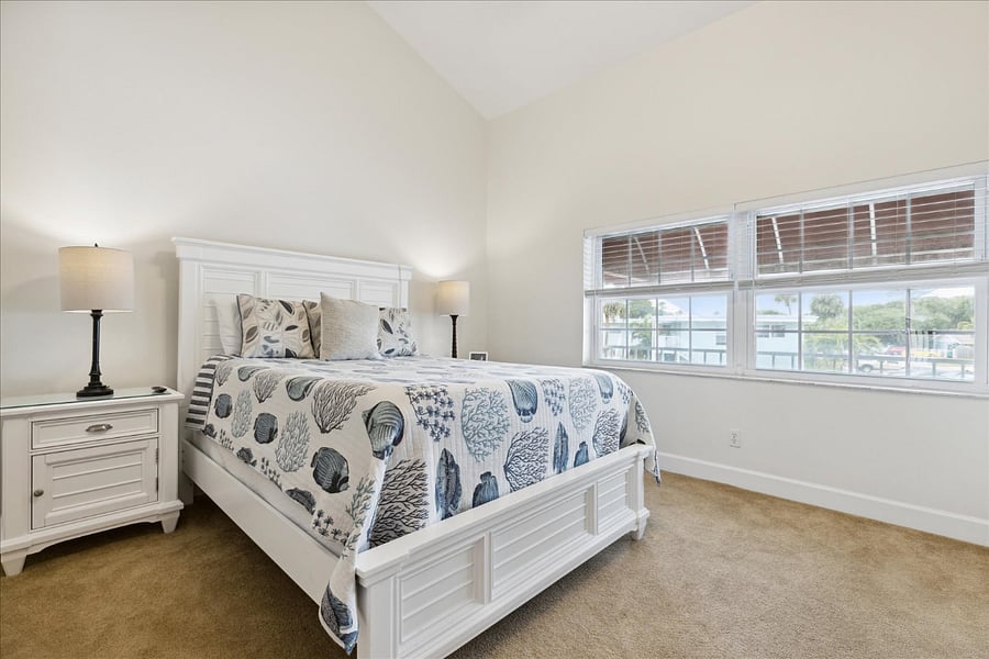 Serene bedroom with soft tones, natural light & a plush king-size bed.