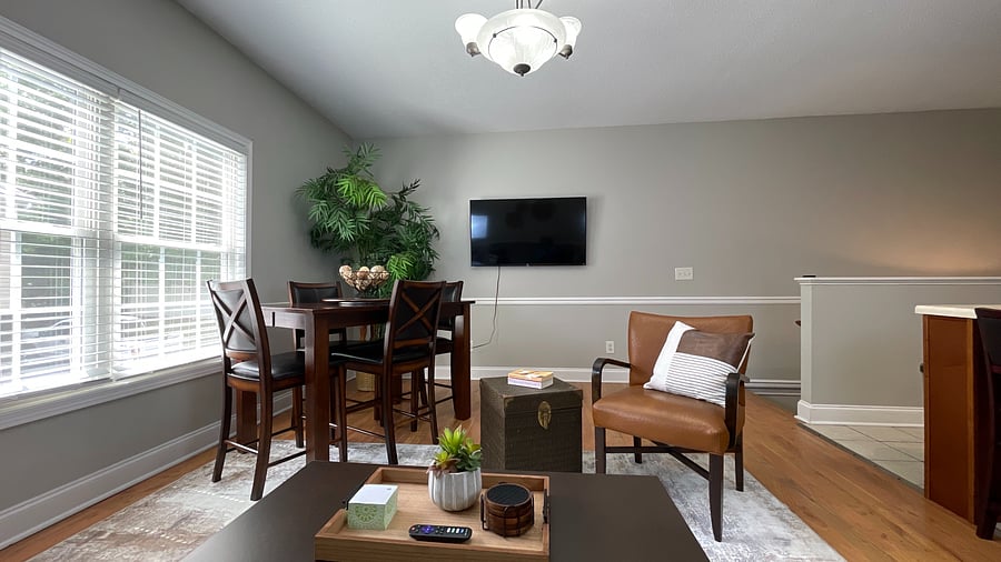 Extra seating, extra comfort! Our living room features stylish wooden chairs perfect for relaxing or entertaining!