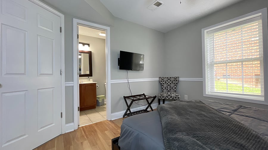 Our elegant queen-sized bedroom offers a beautiful view, making every morning feel special!
