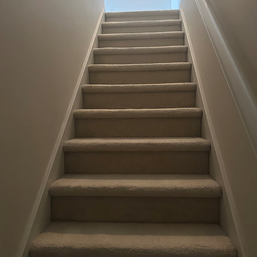 Stairs leading up to unfurnished loft