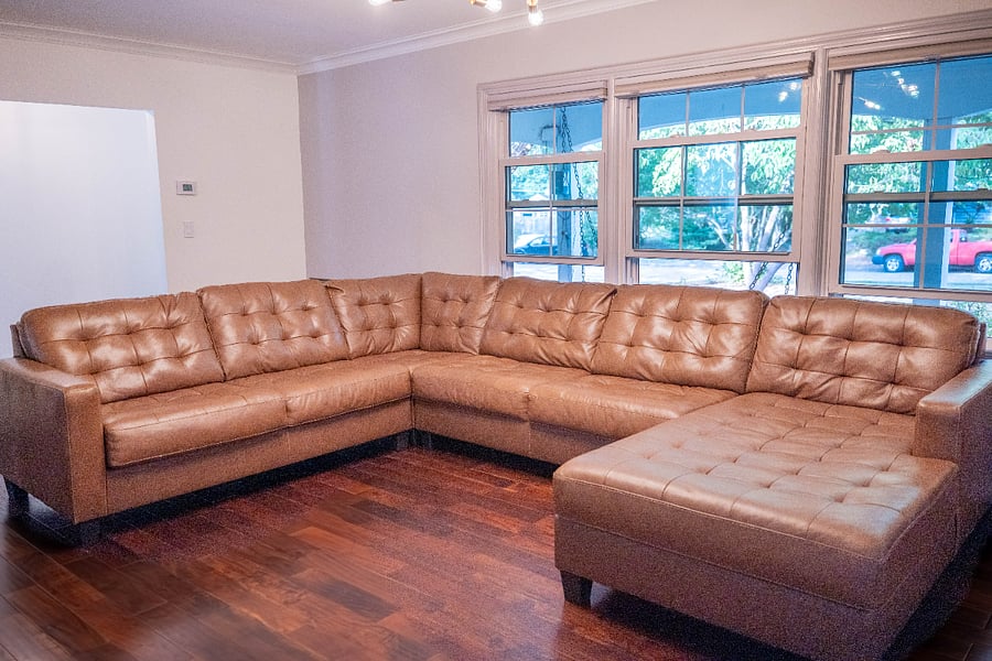 First living room with cozy large sectional for relaxation and unwinding.