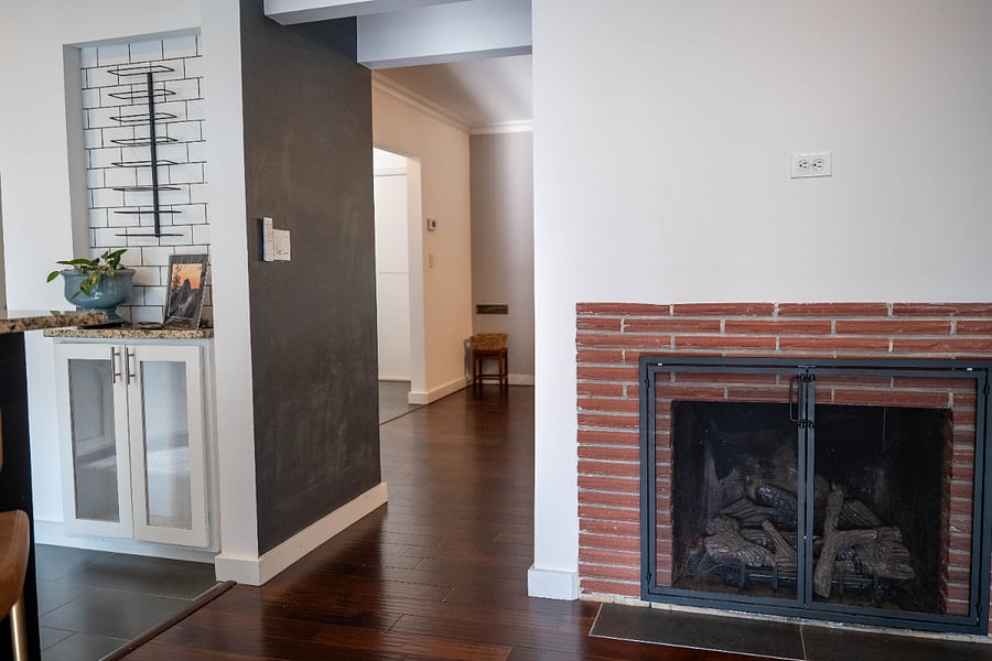 Passage between two living rooms and wine rack