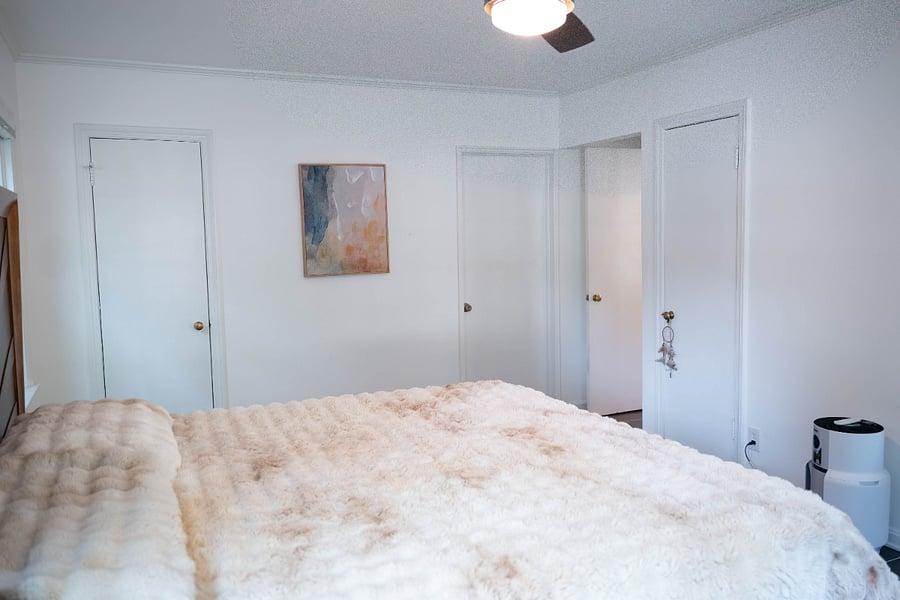 Main bedroom, king memory foam mattress, faux rabbit fur comforter.