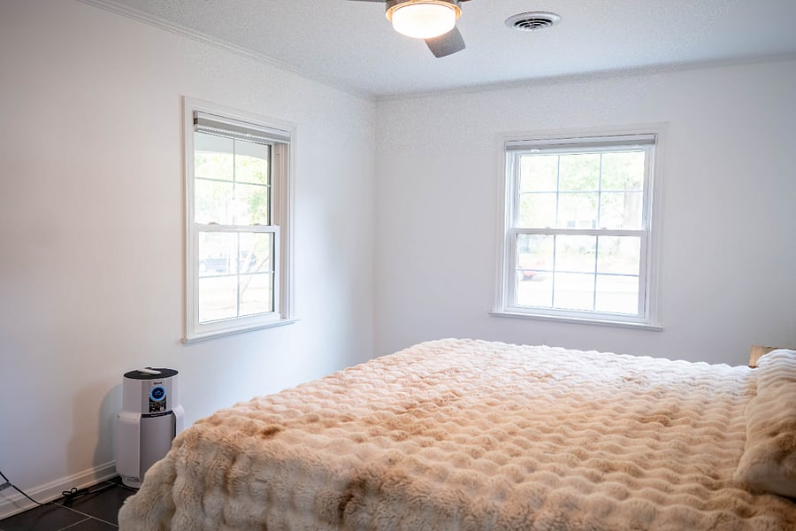 Main bedroom, king memory foam mattress, faux rabbit fur comforter.