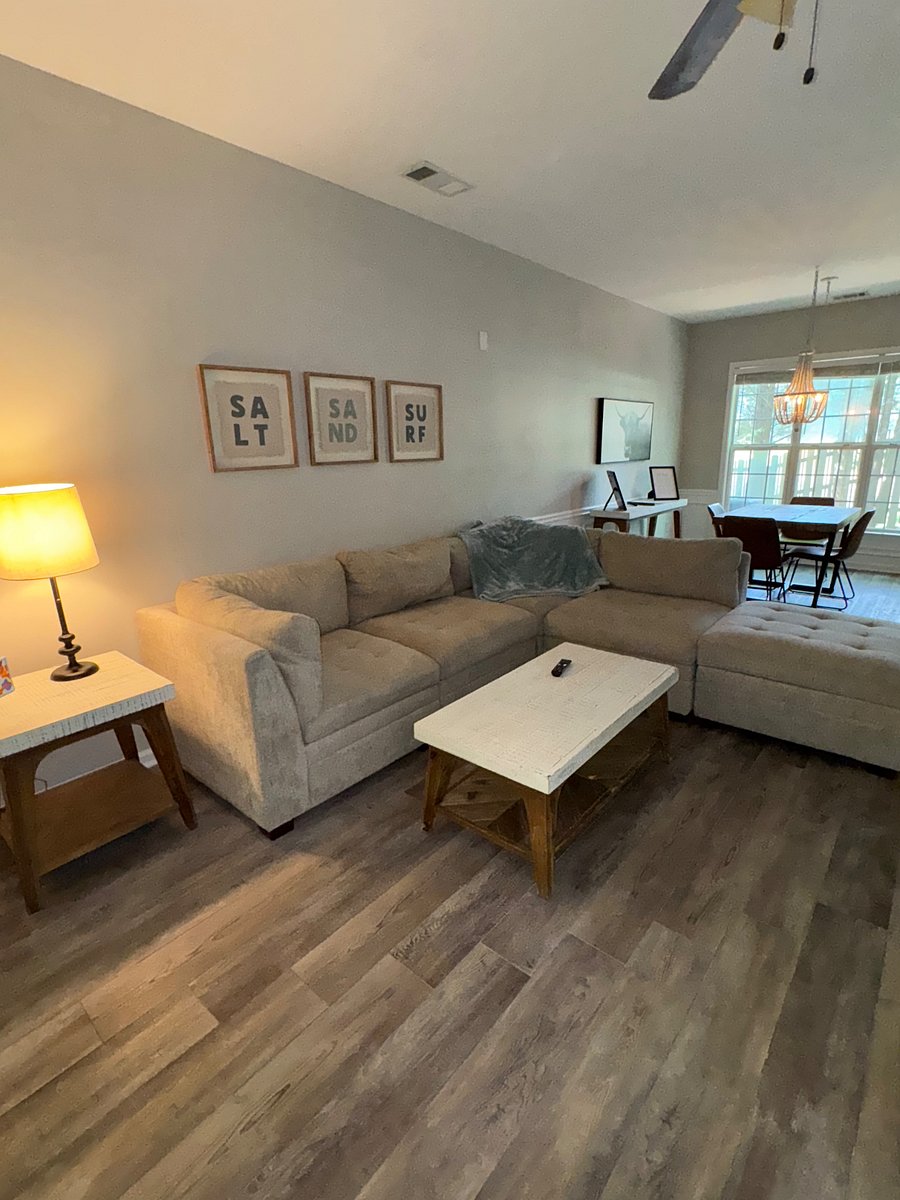 Comfortable & clean sectional. Frontgate side and coffee table