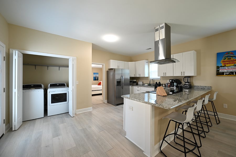 Kitchen view with laundry