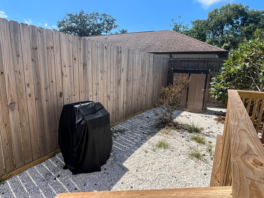 BBQ grill and shed with beach gear