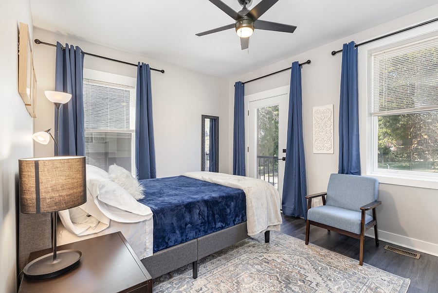 Queen bed, large windows with blinds and black-out curtains