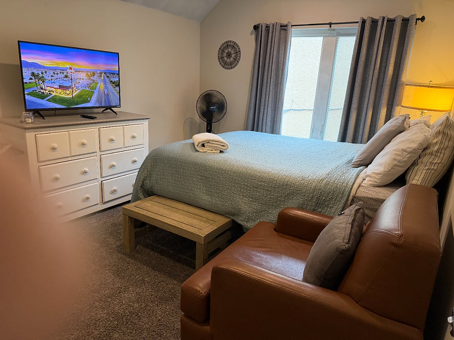 Queen bed, leather hangout chair and table that can pull out from under bed:)