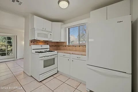 full kitchen equipped with all the basics - cutlery, cookware, glasses, french press coffee maker, etc this microwave has been replaced with a hood-vent there is no microwave in the unit.