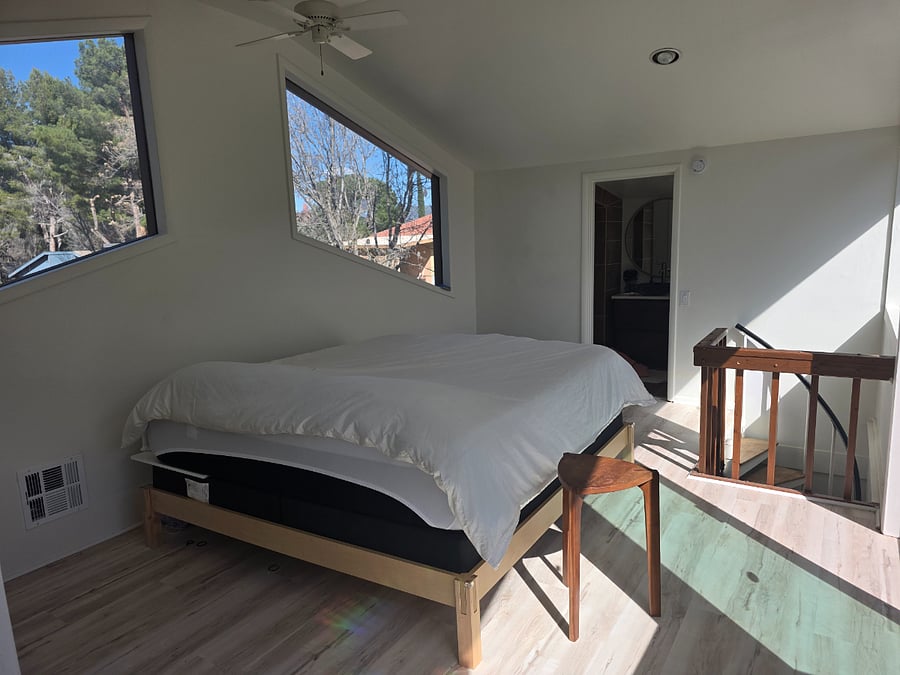 the abundance of windows allows for natural lighting and stargazing from bed at night