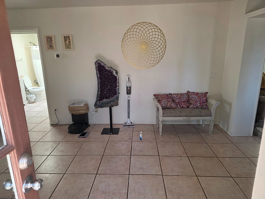 once inside you are in the living room/foyer with entrance to the bathroom for Bedroom 3, den and kitchen.