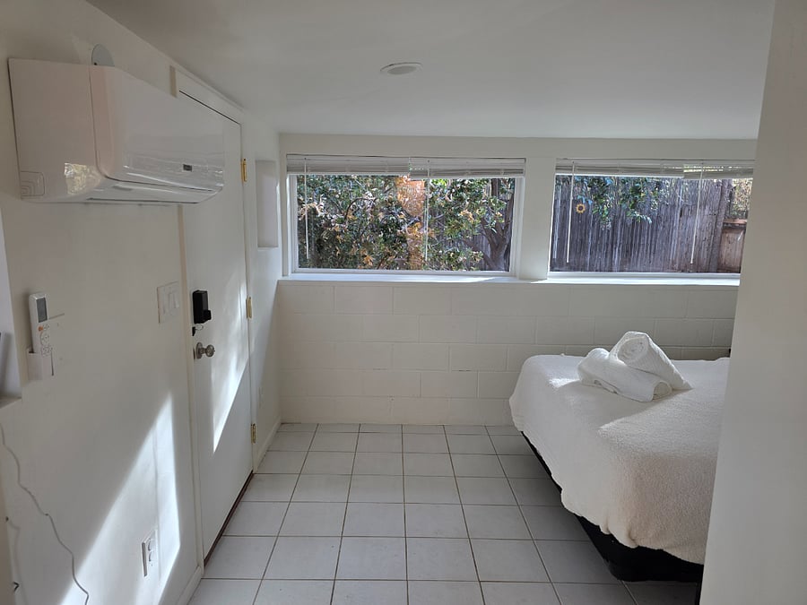 Bedroom 2 is a queen suite overlooking the garden