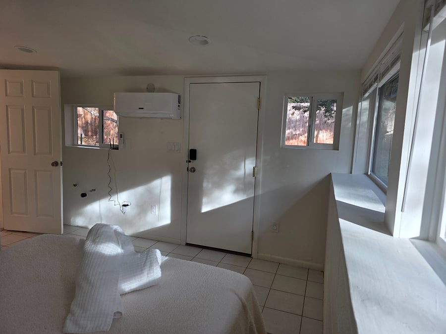Has private entrance from outside or entrance from Den and ensuite bathroom with shower and closet