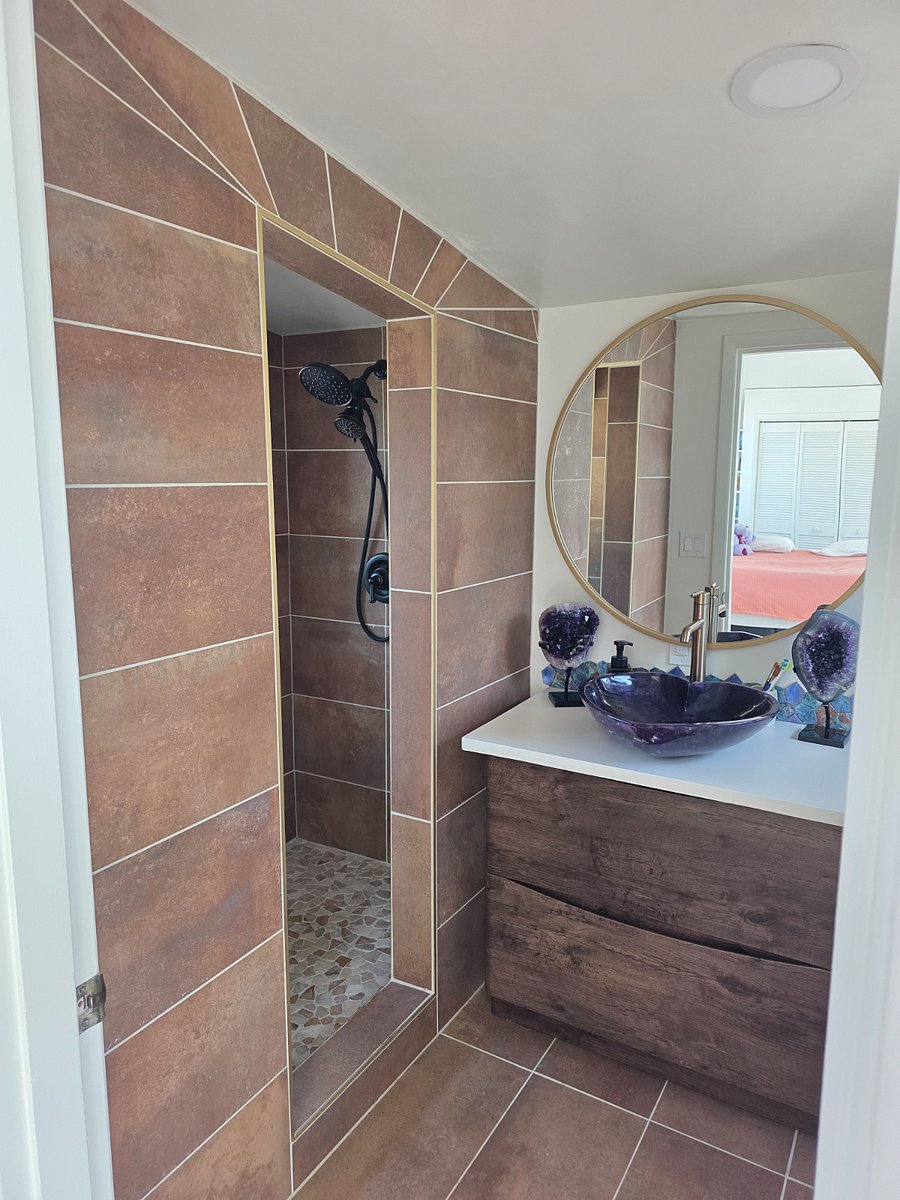freshly rennovated upstairs bath with amethyst sink