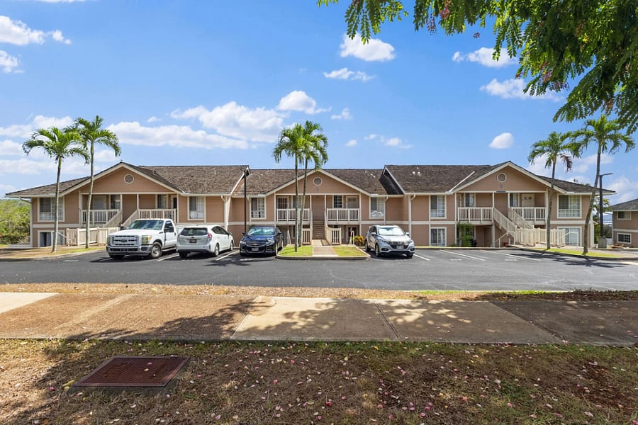 Welcome to your home base in paradise where tropical landscaping, clean architecture, and easy parking make every arrival feel like a vacation.