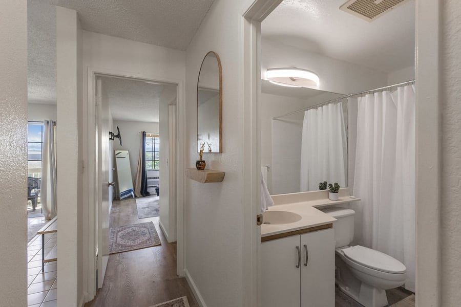 Whether you're heading to a restful bed or a rejuvenating shower, this space guides you there with elegance and ease.