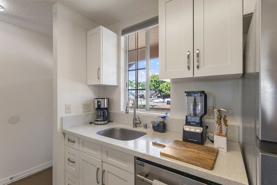 Start your day with fresh coffee, natural light, and a peaceful peek outside. This kitchen corner is as functional as it is inviting.