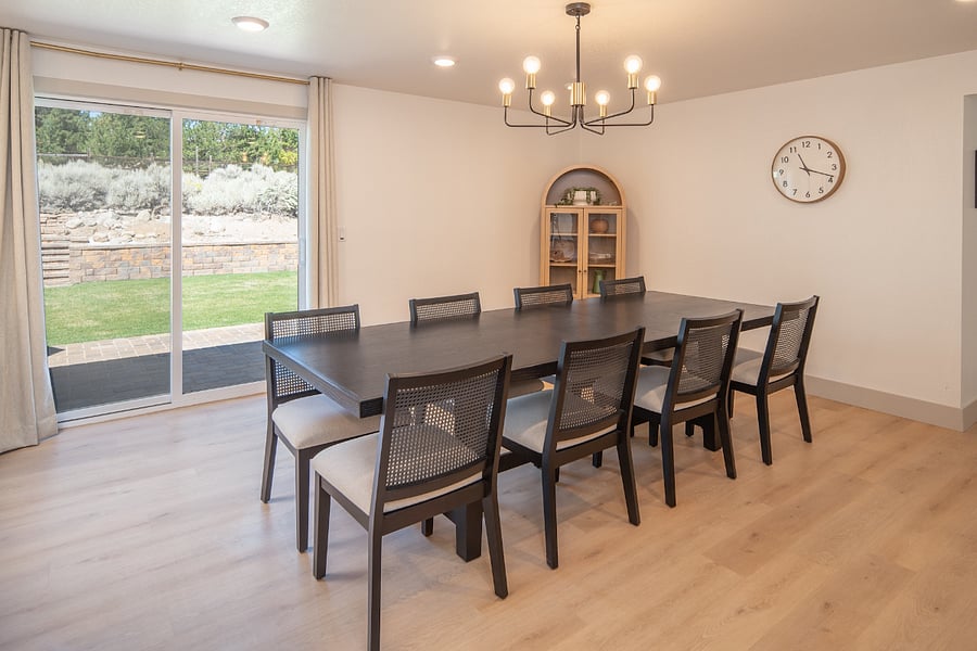 Dining room table with space and chairs for up to 10 people.