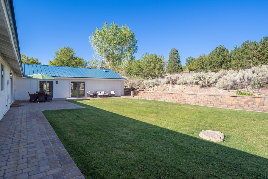 Private backyard with wrap around paver patio for entertaining and relaxation. Grass is professionally maintained.Private backyard with wrap around paver patio for entertaining and relaxation. Grass is professionally maintained.