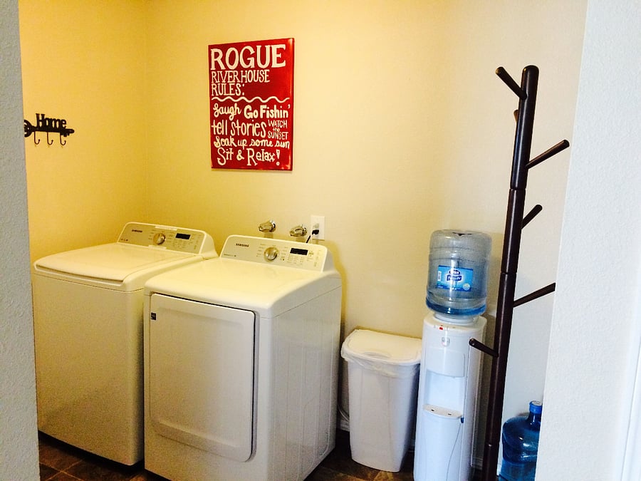 Laundry room, bottled water service and coast rack