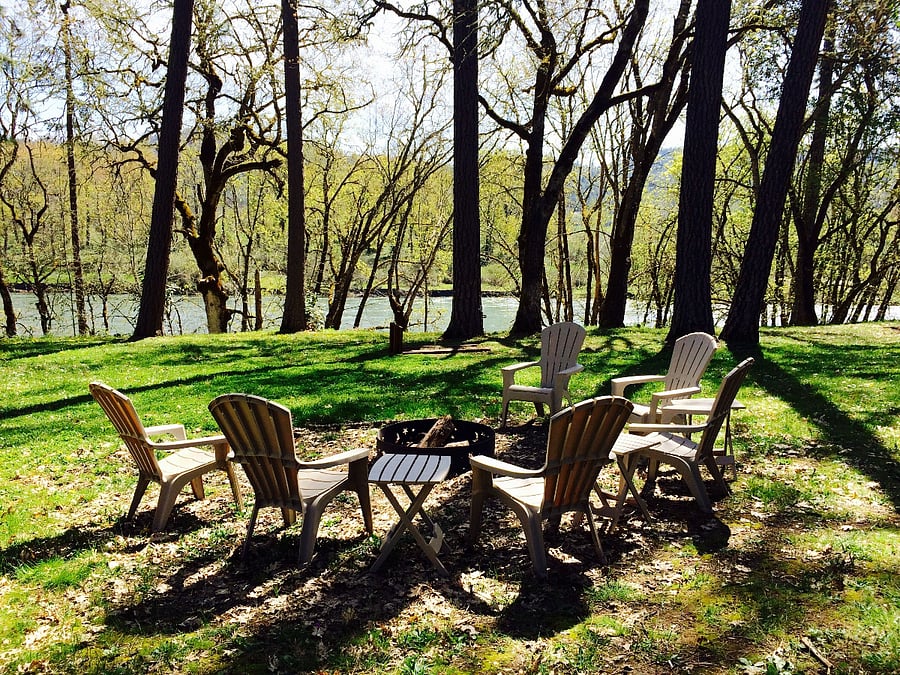 Fire pit and seating overlooking the river