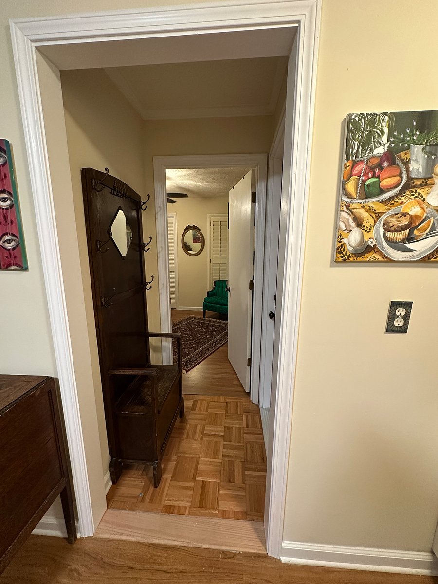 Small hallway between living room and bedroom area.