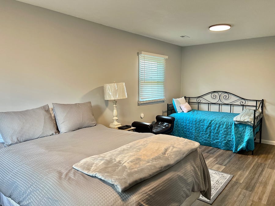 Main bedroom with queen bed and pull-out day bed
