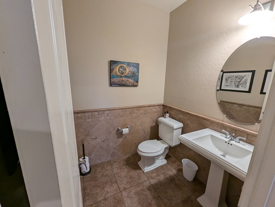 Powder room off front door entry
