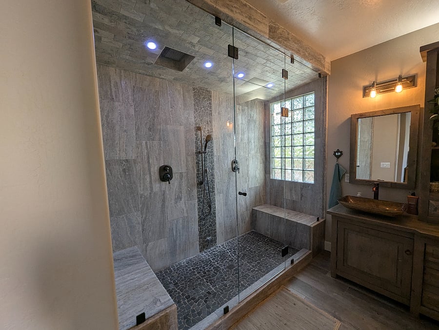 master bathroom suite with a walk in steam bath and double rain shower.