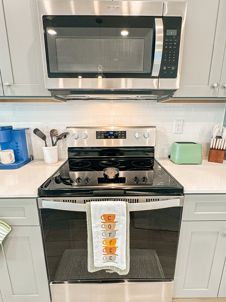 Convenient stainless steel microwave and electric range for all your cooking needs
