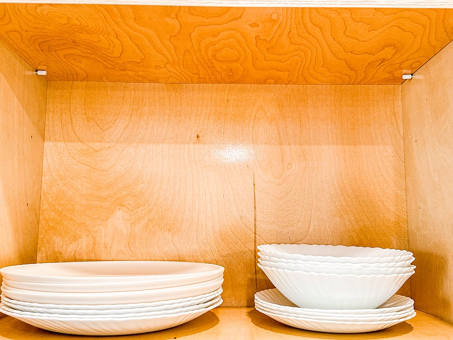 Our kitchen is stocked with a full set of plates and bowls
