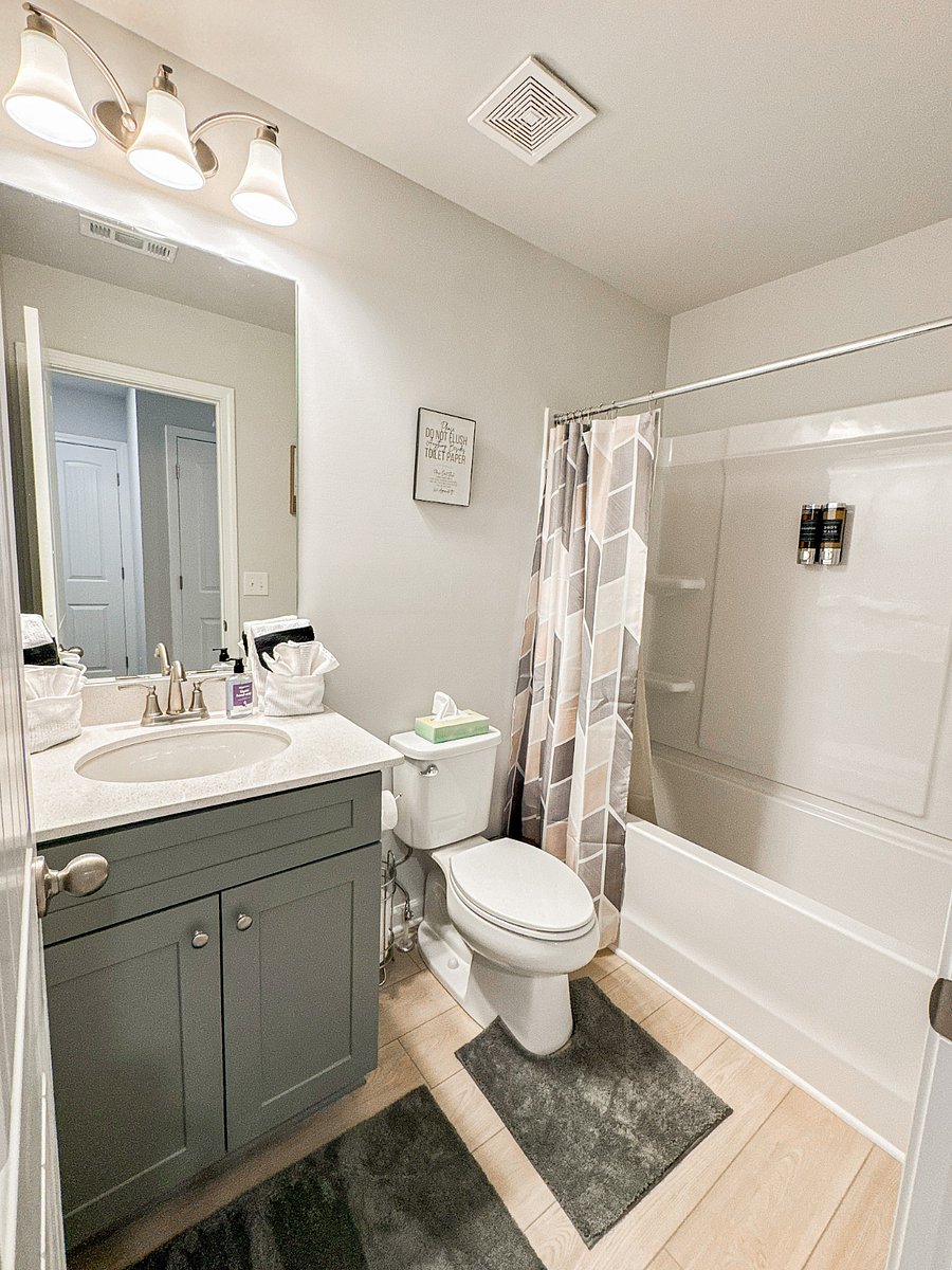 This well-appointed full bathroom is just steps away from Bedrooms 2 and 3, offering easy access for all guests. Complete with modern fixtures and essentials, its perfect for sharing between the two rooms.
