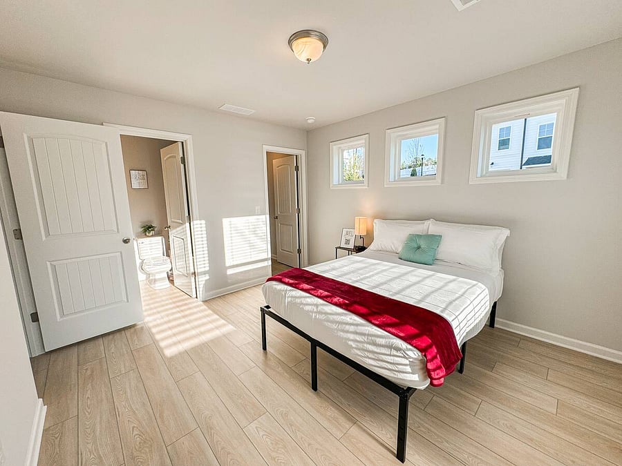 Bedroom 4 offers ultimate convenience with easy first-level access, a private full bathroom for added comfort, and a generous closet equipped with hangers to keep your clothes neatly organized.
