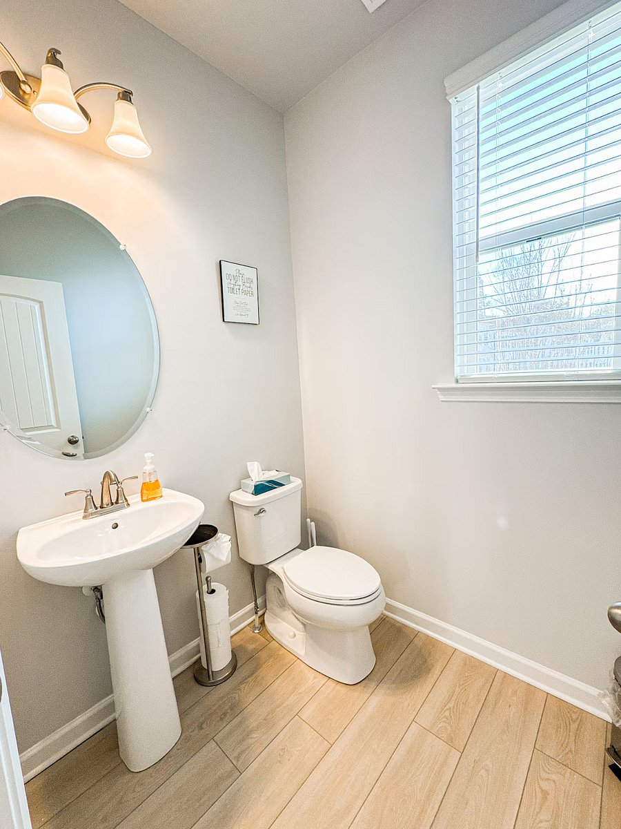 This well-placed half bathroom, located right next to the kitchen, offers added convenience during your stay.
