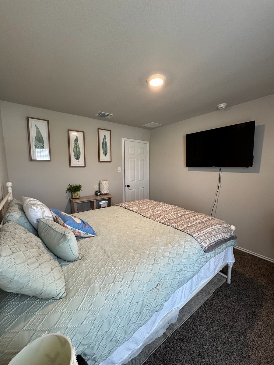 Smart TV mounted in 2nd bedroom