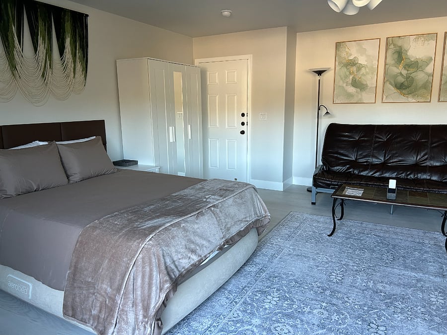 Couch is Queen Futon Bed for Separate Sleeping Area
