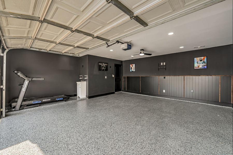 Conditioned garage with exercise equipment.