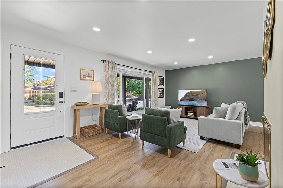 Spacious and bright Living Room with Smart TV, Dimmer Lights, Blinds and Seating Area.