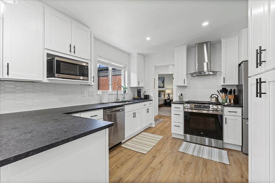 Stunning black 'leather' granite counter tops showcase this modern kitchen.