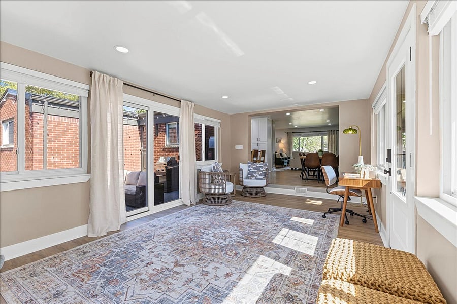 Sliding glass door in breezeway opens to private patio in backyard.
