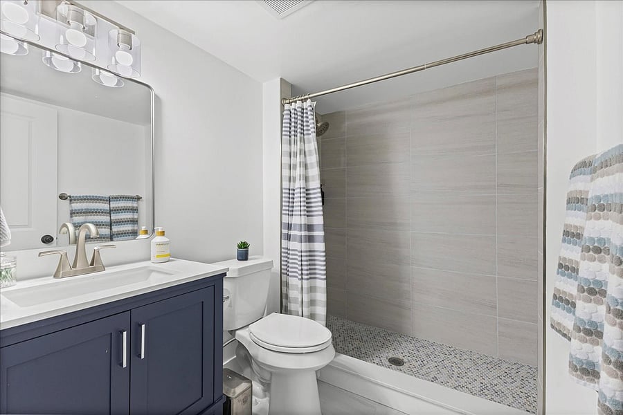 3rd full bathroom in the basement with tiled shower - all new!