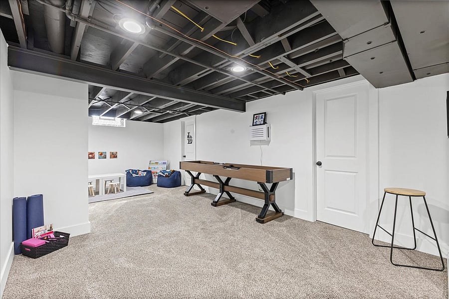 Kids' corner, shuffleboard table, yoga mats and lots of space to play.