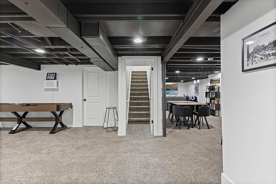 Stairs lead up to back door taking you out to the patio.