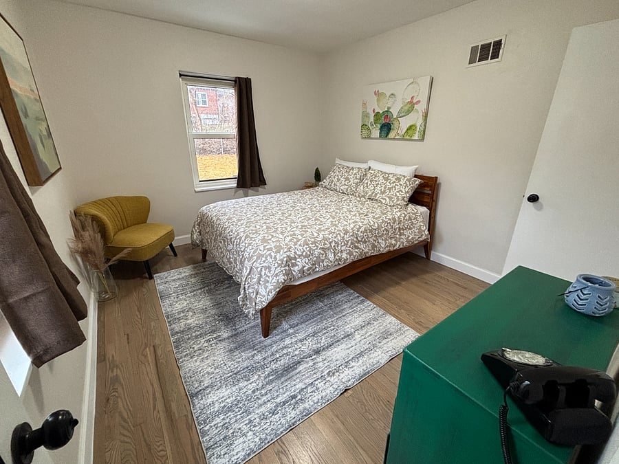 Bedroom with fan and blackout curtains