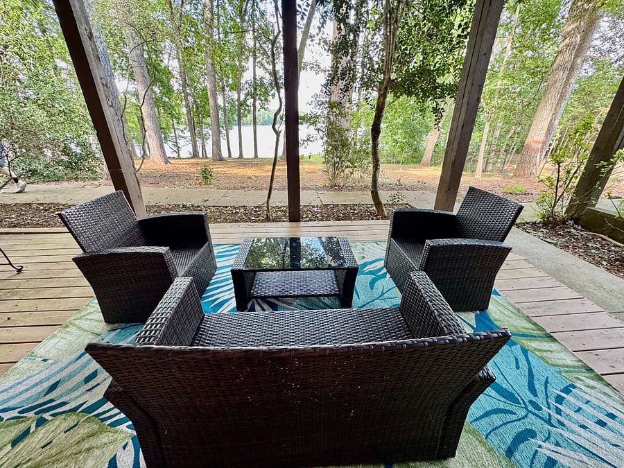 Porch below our deck, wicker furniture, lounge chairs folding chairs available