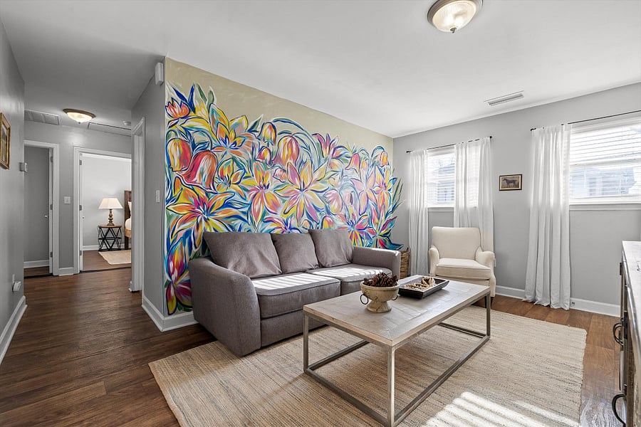 A local artist painted this mural during her stay. The couch does convert to a bed.
